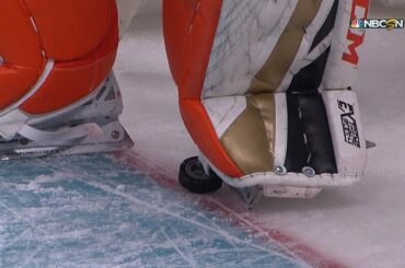 John Gibson steps on the puck on the goal line to deny Scheifele