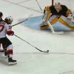 Devils' Coleman fights off Brassard, scores one-handed goal