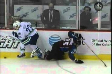 Alex Edler hits Chris Stewart