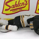 Backes leaves game after hit to head by Carrier