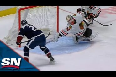 Blackhawks' Alex Stalock Reaches Out To Make Unbelievable Paddle Save On Nathan MacKinnon