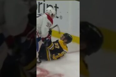 Rem Pitlick runs over Patrice Bergeron