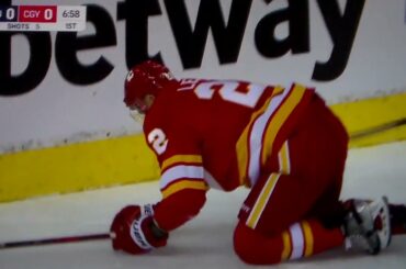 Canucks' Tyler Myers hits Flames' Trevor Lewis hard into boards, receives game misconduct