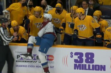 Mark Borowiecki sends Erik Johnson into the Predators bench