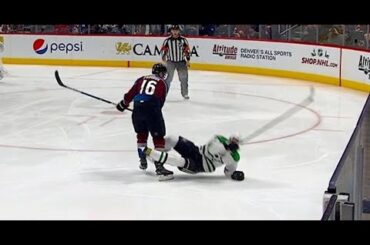 Stars’ Janmark tries to enter the zone but gets leveled by Zadorov