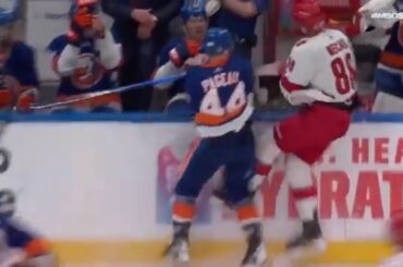 Jean-Gabriel Pageau flips Martin Necas into the bench with a big hit