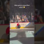 A Colorado Avalanche player give his stick to a fan