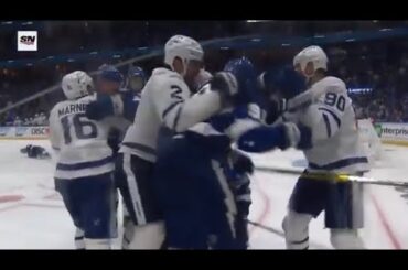 Morgan Reilly hits Brayden Point into the boards and Kucherov responds