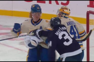 Auston Matthews and Rasmus Dahlin exchanging cross-checks