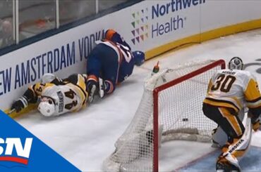 Erik Gudbranson Smashes Into End Boards After Colliding With Anders Lee