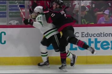 Andrei Svechnikov cross-checks Tyler Seguin