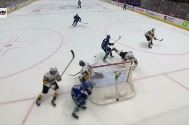 Quinn Hughes putts Jack Eichel out of the way to win game