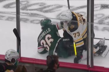 Charlie McAvoy throws a hit on Mats Zuccarello