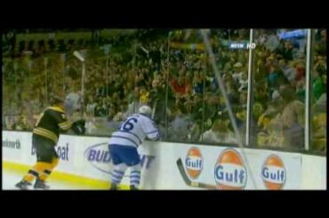 Milan Lucic hits Mike Van Ryn through the glass 10/23/08