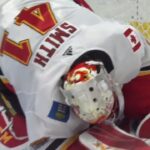 Smith appears to be shaken up late in the game but stays in