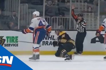 Leo Komarov Drops David Pastrnak With The Butt End Of His Stick