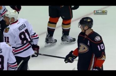 Perry tries to steal Hossa’s stick