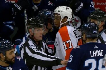 Flyers' Simmonds with a show of sportsmanship after taking down Jets' Ehlers