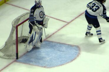 Pavelec and Hutchinson during pre-game warm-up at the Jets @ Senators hockey game