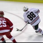 Panarin one-times Kane’s no-look pass past Howard