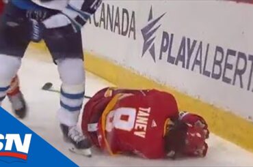 Chris Tanev Slow To Get Up After Getting Crushed Against Boards By Pierre-Luc Dubois
