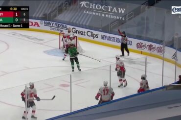 Jason Dickinson gets cross checked in the back by Dillon Dube