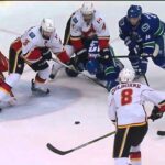 Nick Bonino gets cross checked by Kris Russell