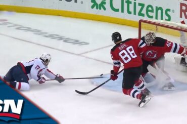 Capitals' Strome Swats Puck Past Schmid While Falling to Score Unbelievable Goal vs. Devils