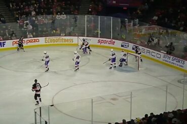 Laval Rocket's Strauss Mann dives to stop Belleville Senators' Josh Currie 11/15/23