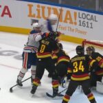 Canucks Vs Oilers Scrum, Connor McDavid Gets Away With Cross Check