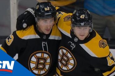 Brad Marchand fights off two Penguins before teeing up Torey Krug