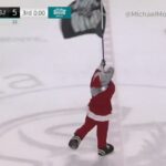 San Jose Barracuda’s Frenzy Accidentally Hits Calgary Wrangler's Player Emilio Pettersen with Flag