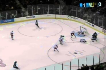 Double Tough: Xavier Ouellet makes the defensive play then takes a high stick to the face