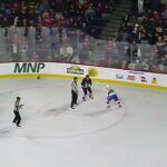 Laval Rocket's Riley McKay and Manitoba Moose's Jeff Malott get into a fight at the end of the game