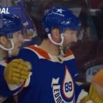 Sam Gagner of the Edmonton Oilers scores from behind goal line vs the Calgary Flames 20-01-2024