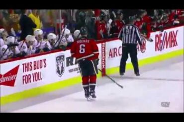 Dennis Wideman cross-checks referee