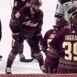 Sean Durzi takes puck to the face