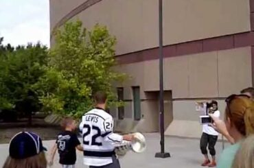 Trevor Lewis Walks Into Maverik Center With The Cup