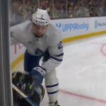 Benoit takes down Marchand in the corner