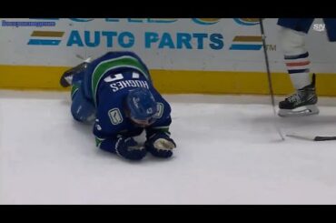 Quinn Hughes was upset and forced to leave the ice after McDavid cut him open with a high stick.