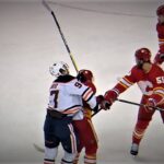 Mikael Backlund Hits McDavid Up High Late In The First Period