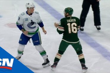Jake Virtanen Fights Jason Zucker After Body Check On Antoine Roussel