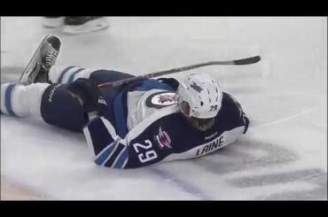 Patrick Laine gets hit by Jake McCabe