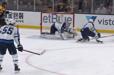Connor Hellebuyck gets full extension to rob Bergeron