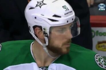 Equipment manager feeds Tyler Seguin chocolate on the bench after goal