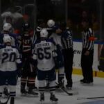 Crunch defenseman Luke Witkowski fights the Senators' Garrett Thompson