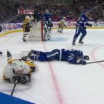 Auston Matthews and Sidney Crosby collide