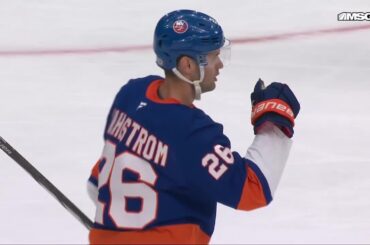 Oliver Wahlstrom scores a goal against the New Jersey Devils