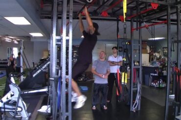 Kris letang trying the TRX training station at APC