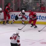 Shayne Gostisbehere scores a goal against the New Jersey Devils
